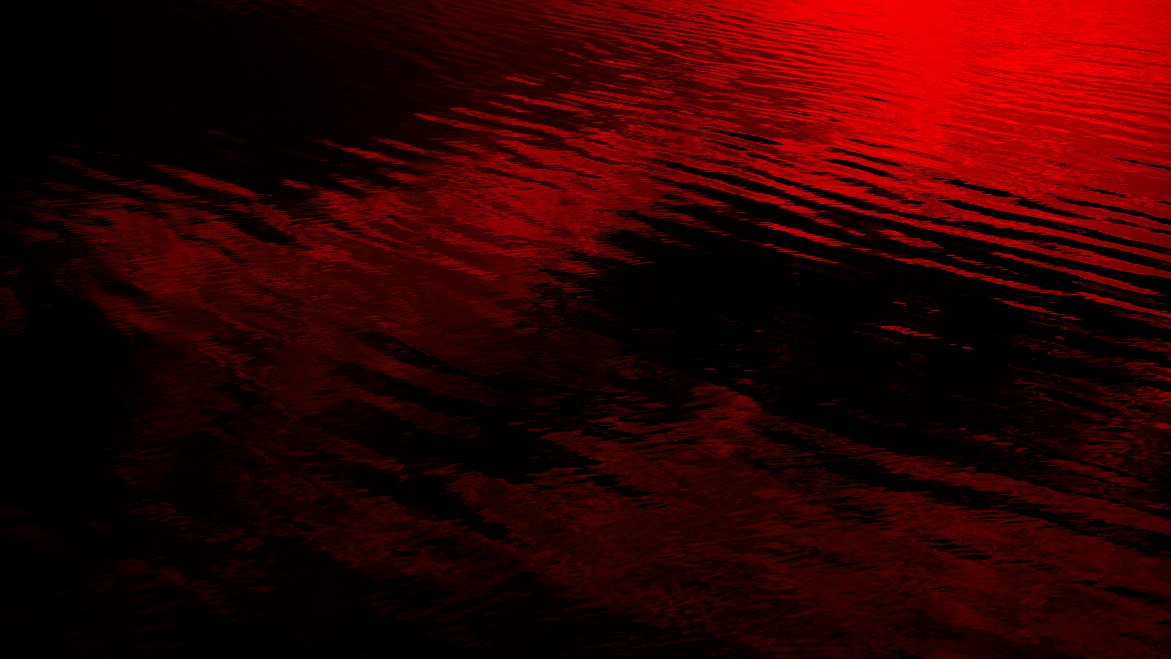 Fond abstrait noir et rouge. Réflexion de la lumière dans l'eau calme.